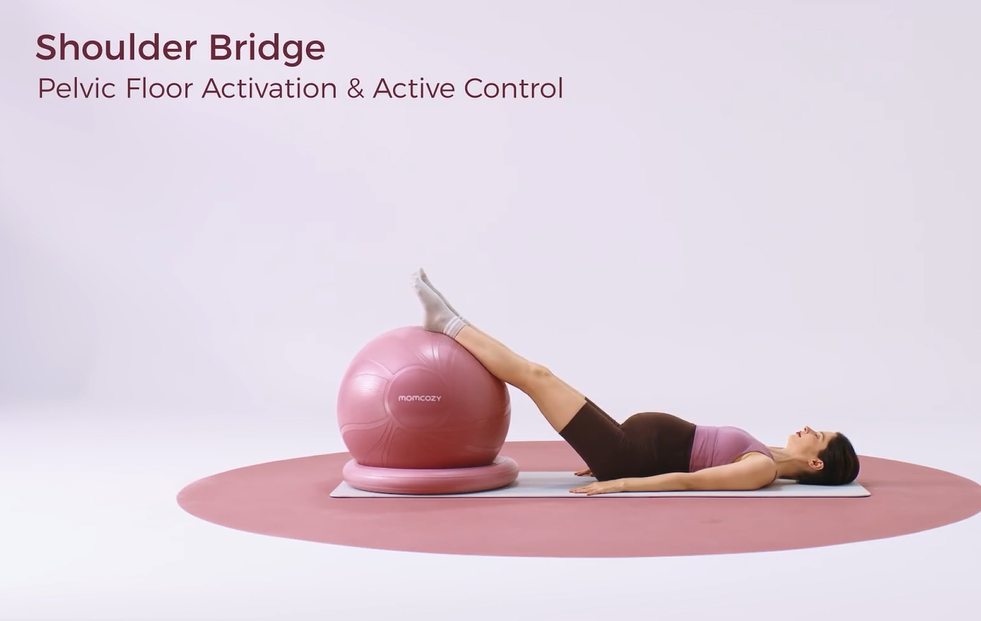 Pregnant woman shoulder bridge with feet on stability ball for pelvic floor activation