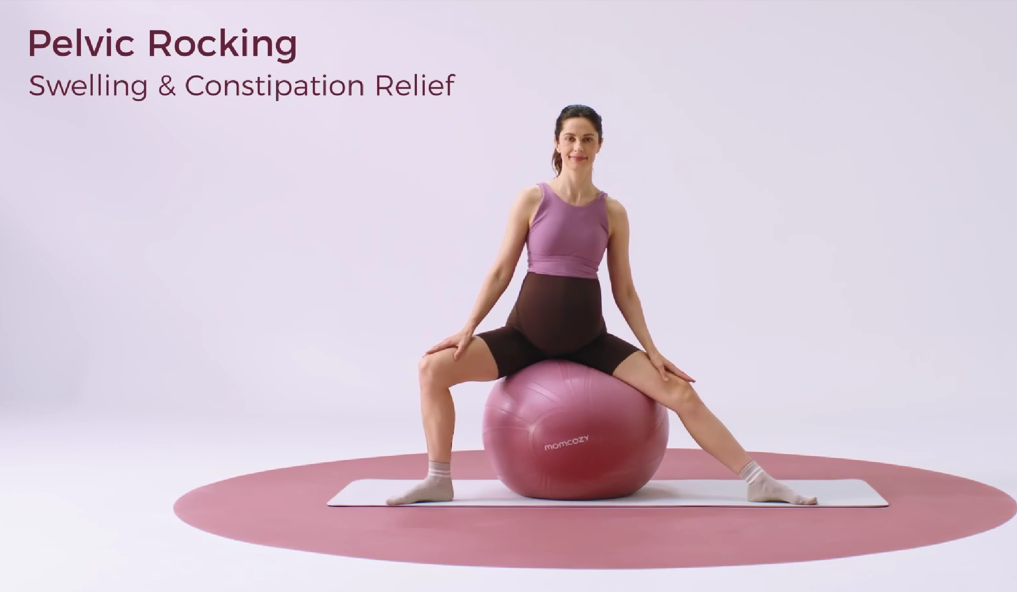Pregnant woman doing pelvic rocking exercise on a stability ball for swelling and constipation relief