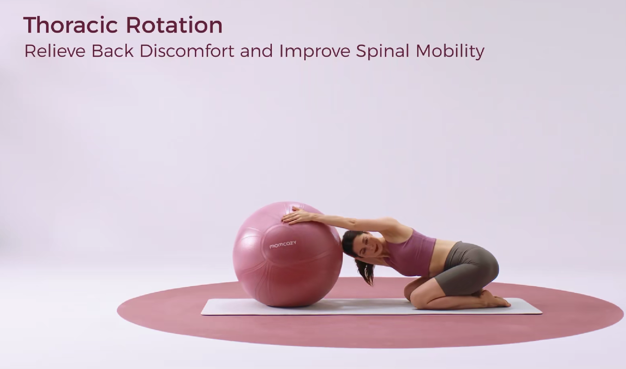 Pregnant woman performing thoracic rotation on hands and knees with exercise ball, relieving back discomfort